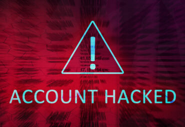 Account hacked concept with exclamation mark in warning triangle on red background. Loss of access. The background is blurred in motion.