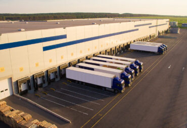 distribution warehouse with trucks of different capacity.