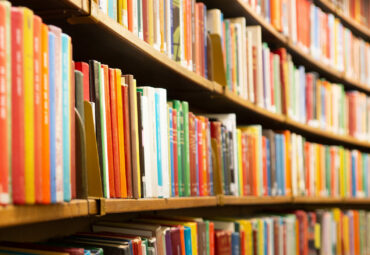 Library with many shelves and books, diminishing perspective and shallow dof