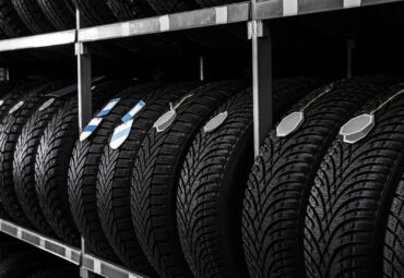 Car tires on rack in auto store